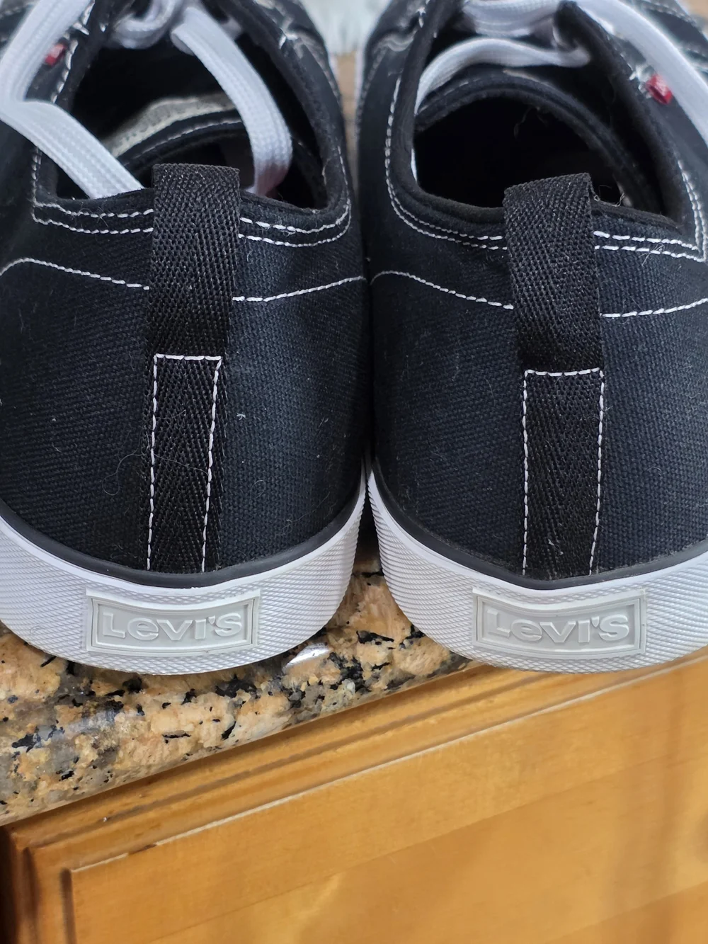Levi's Men's Black Canvas Low-Top Sneakers with White Accents and Red Tab